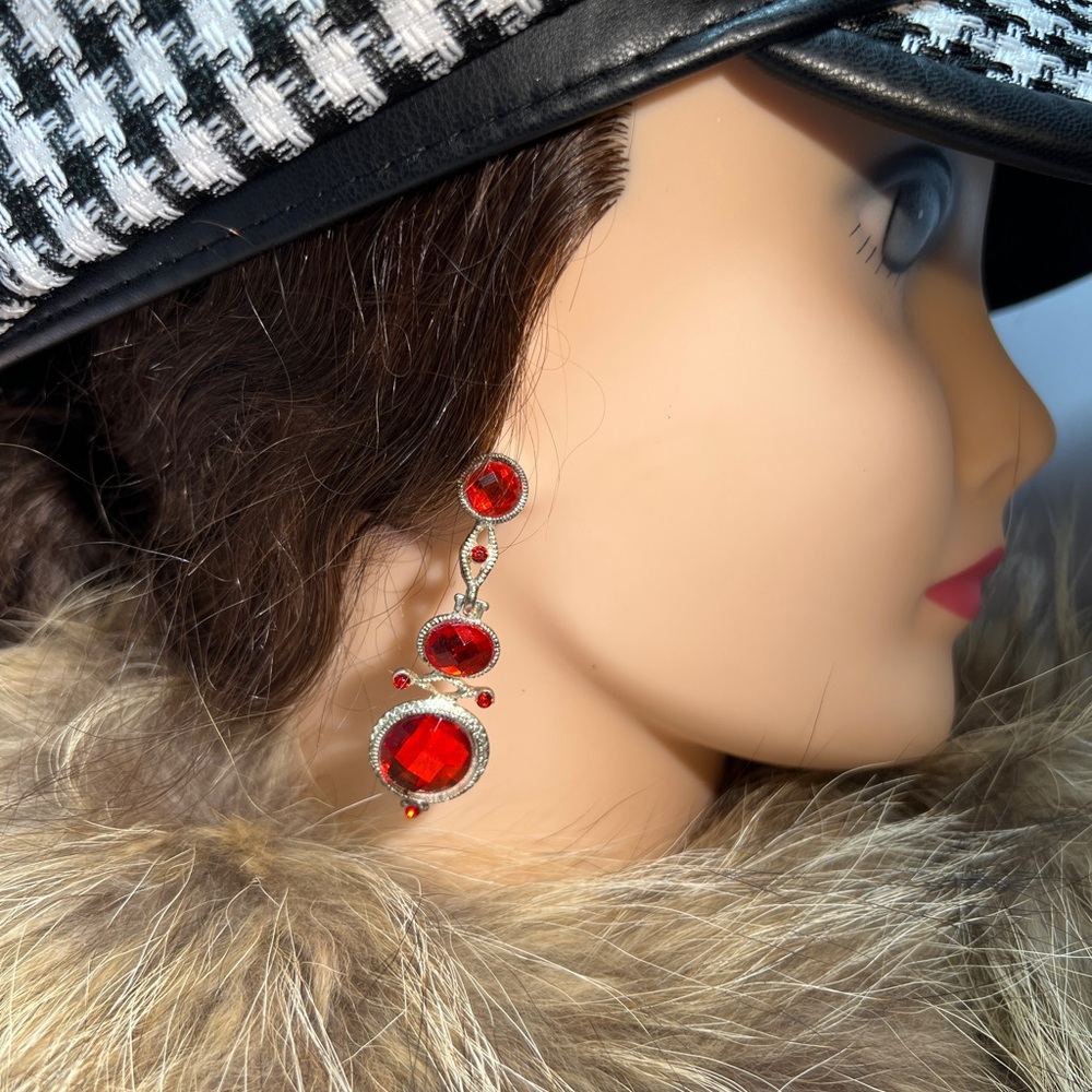 Silver tone dangle red gem earrings
